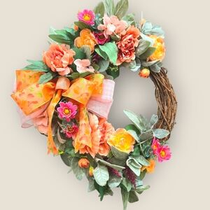 Peach and Pink Holiday Wreath with Festive Ribbon